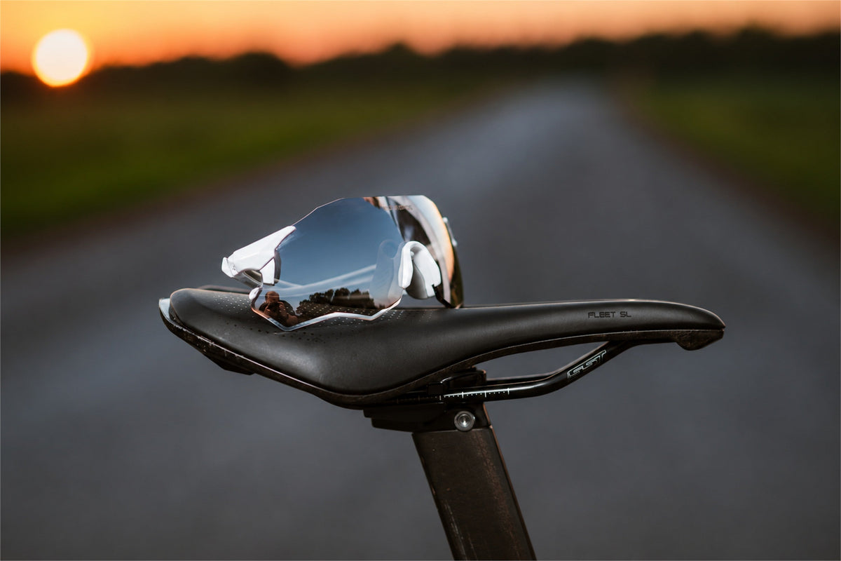 Bicycle saddle set against an evening road backdrop
