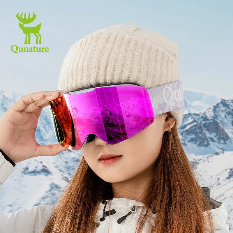 Person wearing a pink and gold ski mask with a mountainous background and Qunature logo.