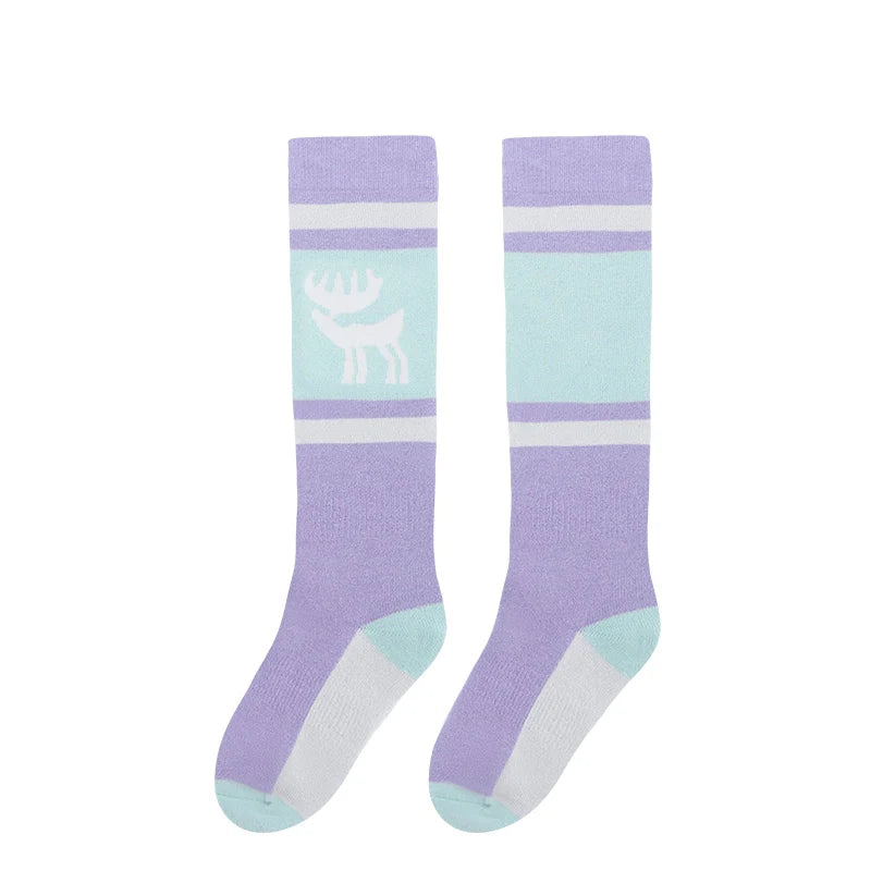 One pair of pink knee-high ski socks with a reindeer pattern#Color_Pink-Purple