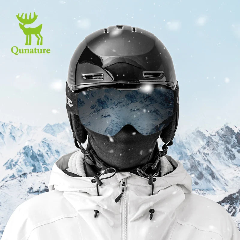 Person wearing a black helmet and goggles with a snowy mountain background, featuring the Qunature brand.