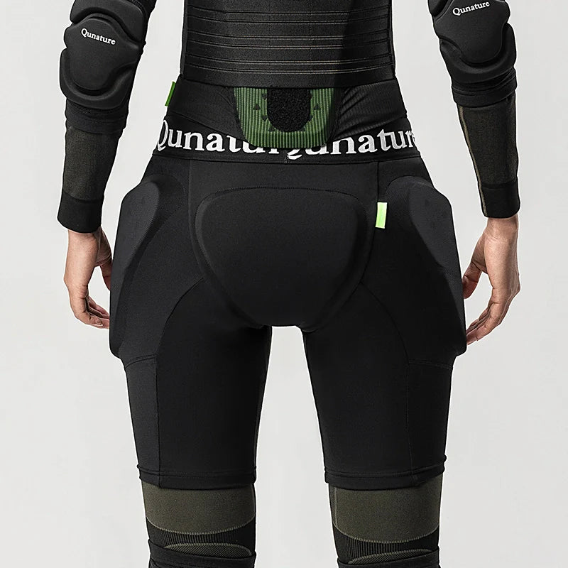 Person wearing black protective gear with 'Quanature' branding on a white background