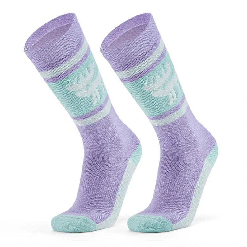A pair of purple wool ski socks with a striped design and a reindeer logo on the ankle#Color_Purple