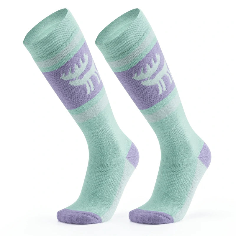 A pair of green wool ski socks with a striped design and a reindeer logo on the ankle#Color_Mint Green
