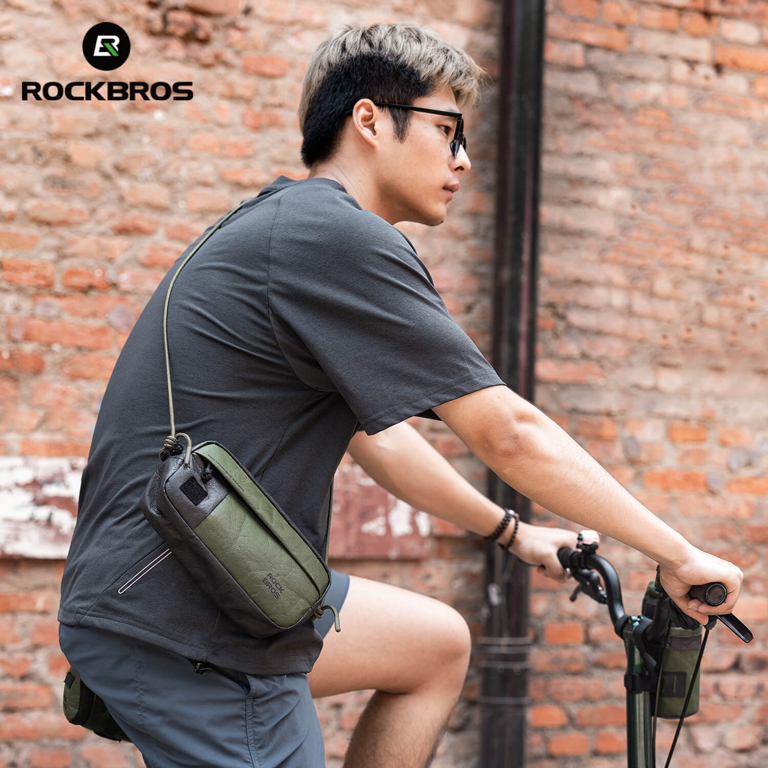 rockbros tyvek handlebar bag with adjustable shoulder strap, reflective logo and zip pockets