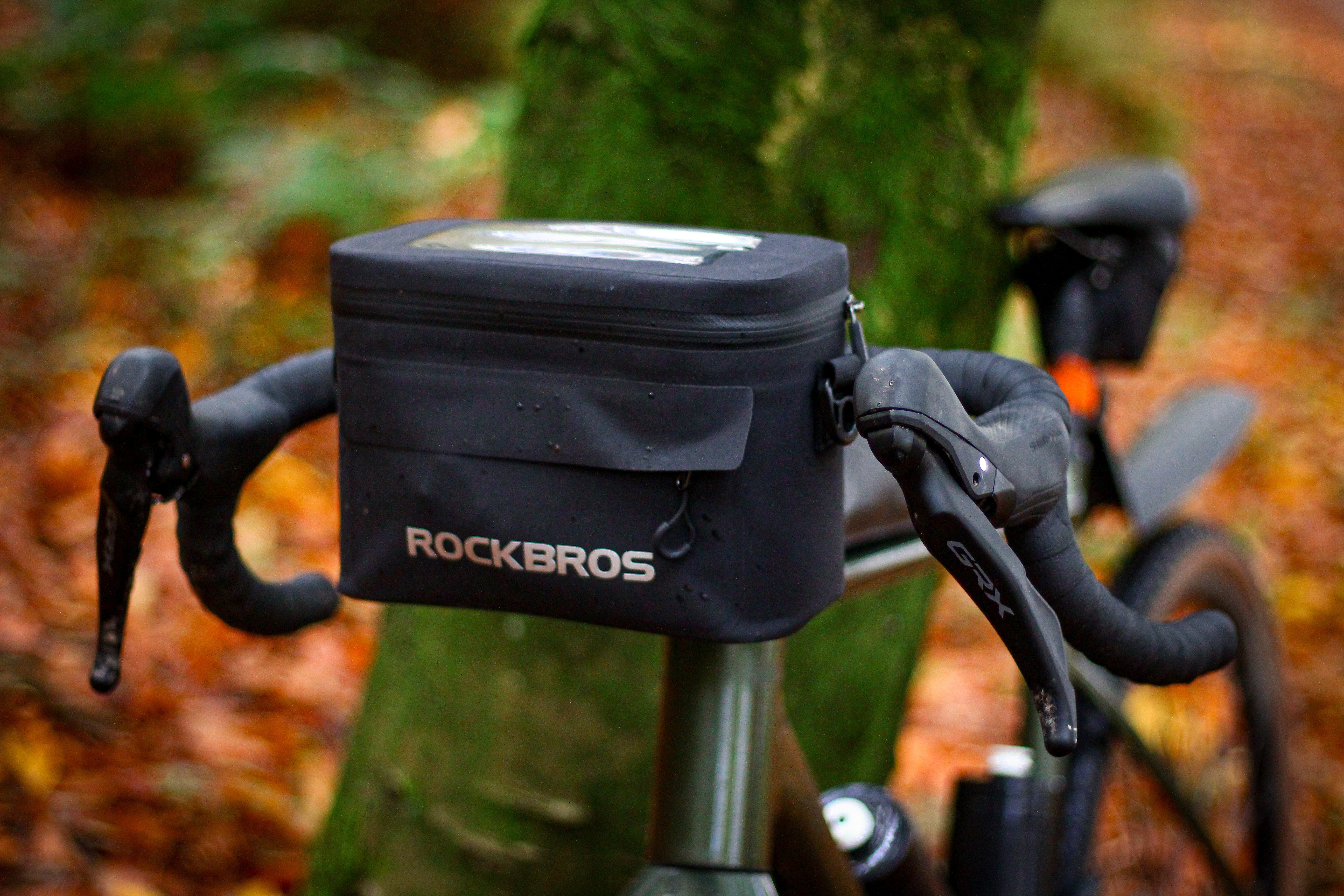 ROCKBROS handlebar bag fitted between drop-bar controls on a bicycle