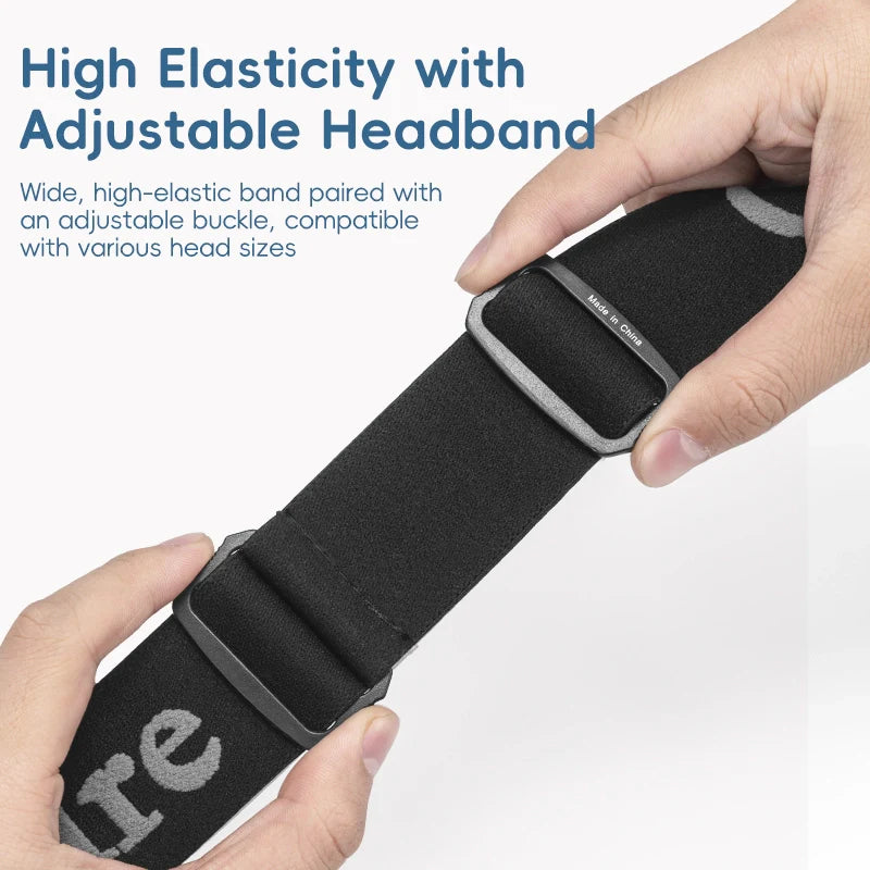 Black headband with adjustable buckle held by hands on a light gray background