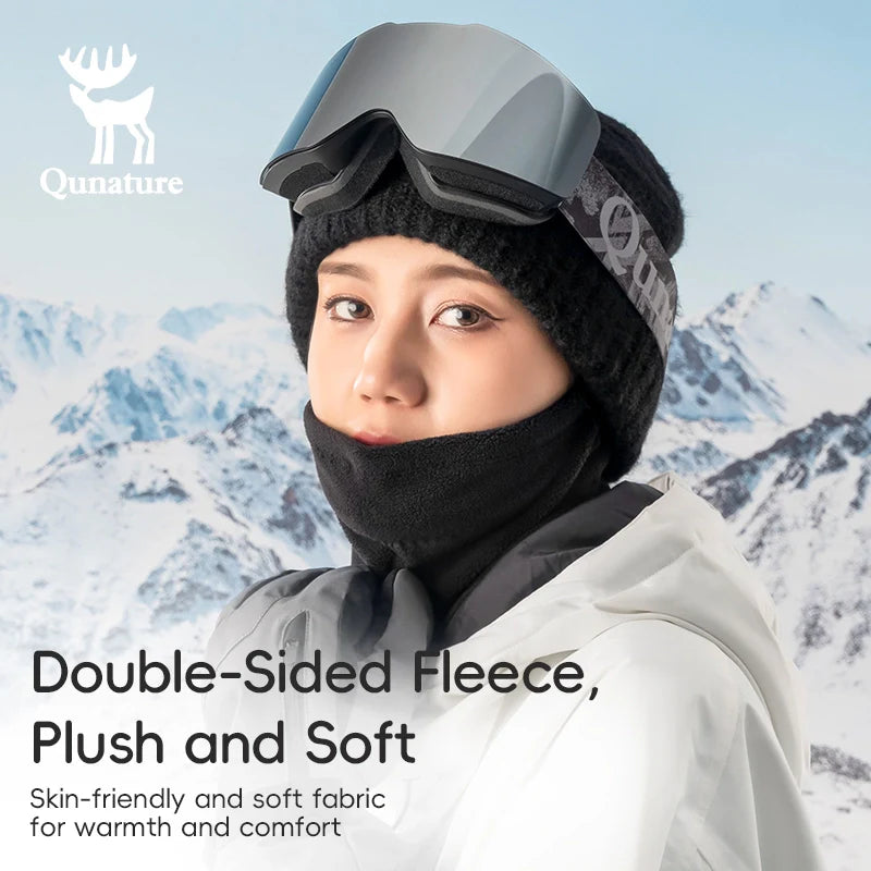 Person wearing winter gear with mountains in the background, featuring Qunature branding.