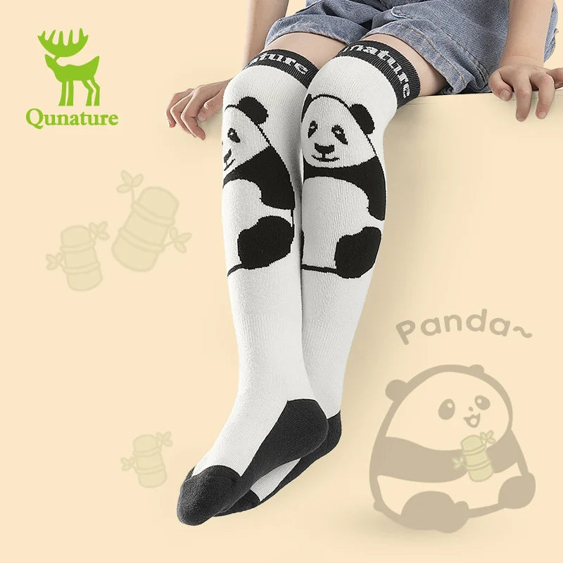 Panda-themed knee-high socks with Qunature branding on a beige background.