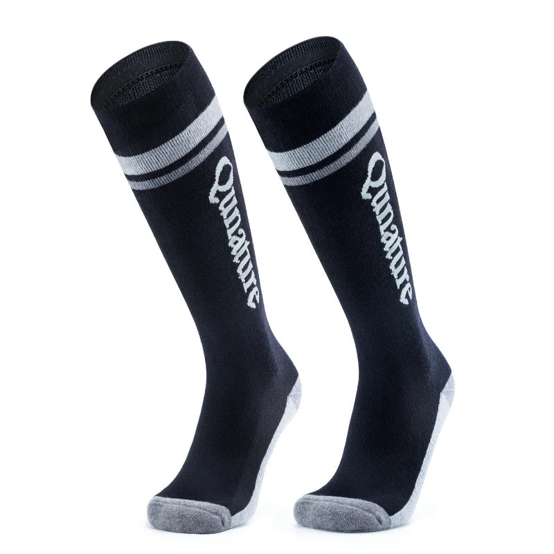 A pair of black wool-blend children's ski socks#Color_
Abyss Blue
