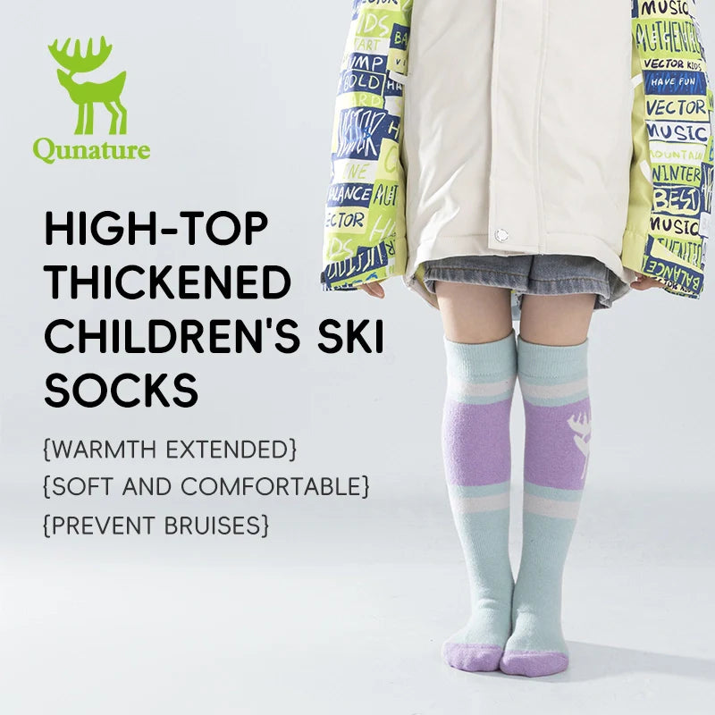 A child wearing knee-high ski socks with a reindeer pattern