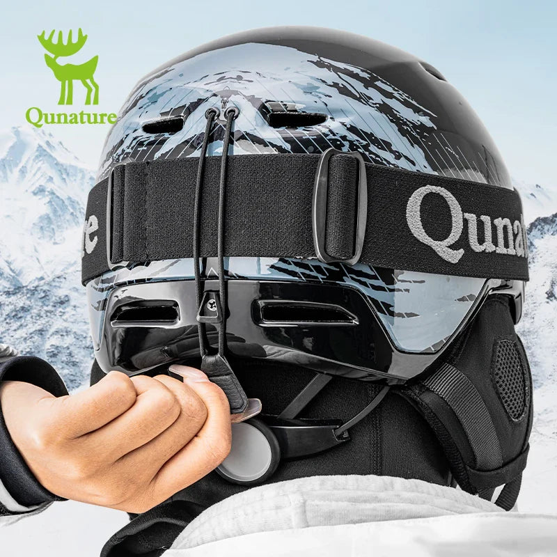 Person adjusting a black helmet with a mountainous background, featuring the Qunature brand.