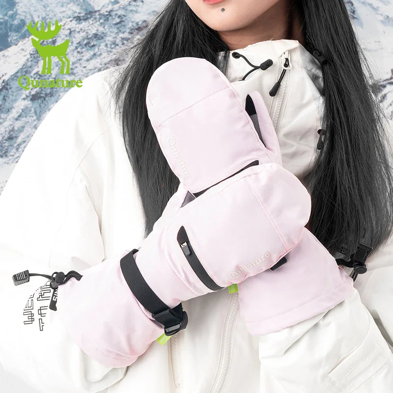 Person wearing pink gloves with black straps in a snowy landscape, featuring the brand 'Ounature'.