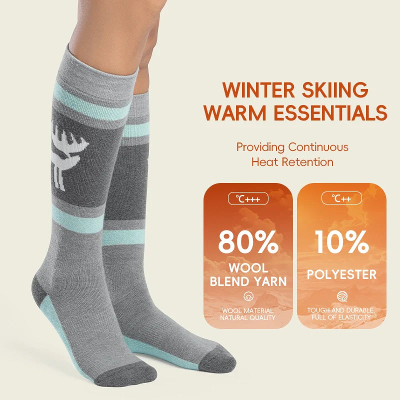 Gray knee-high socks with blue stripes worn by a person, on a beige background with text about winter skiing warm essentials.